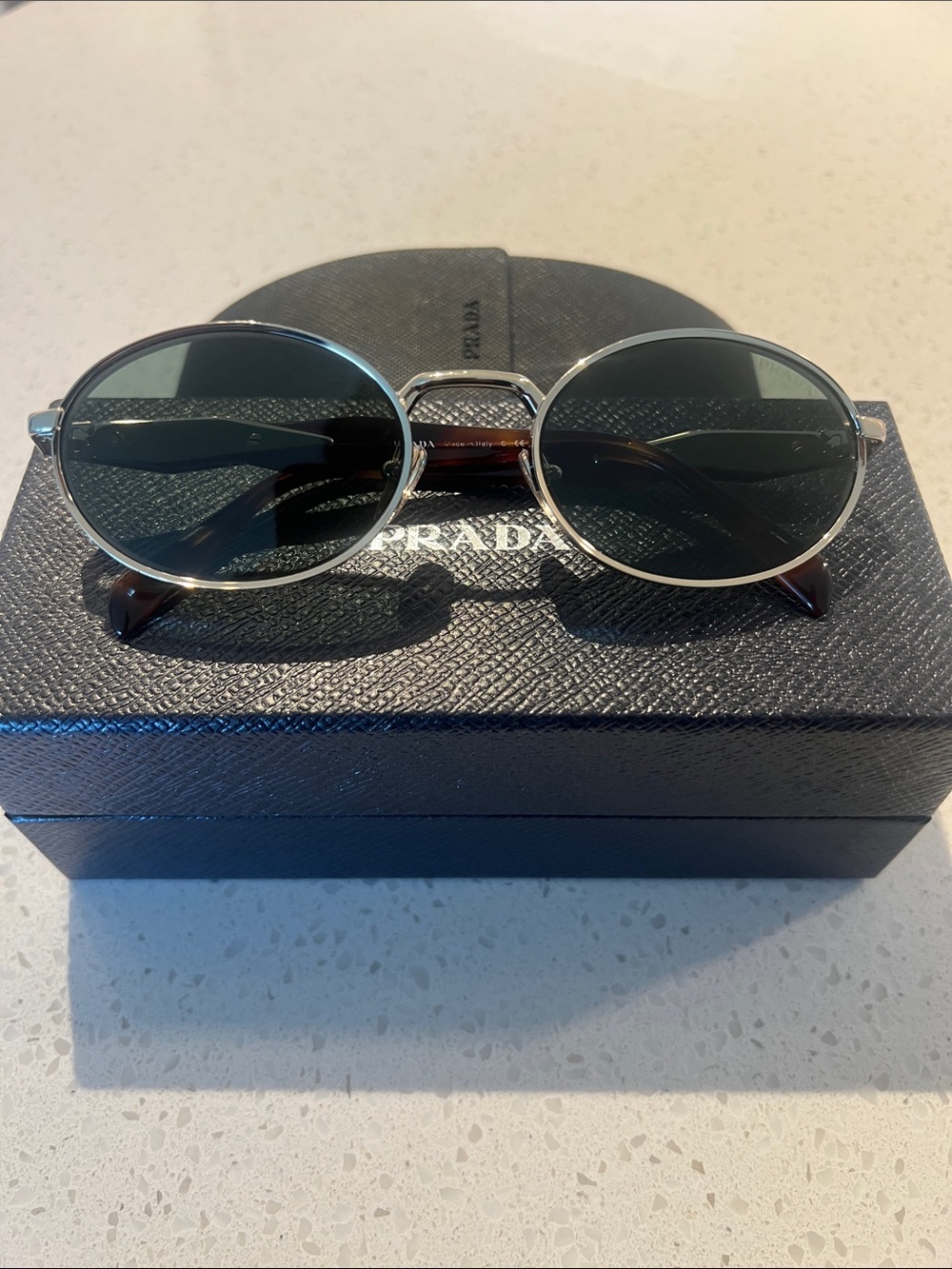 Prada Gold Round Frame Sunglasses with Dark Lenses